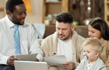 httpselements.envato.comcouple with kid having meeting with adviser KWH3DA9